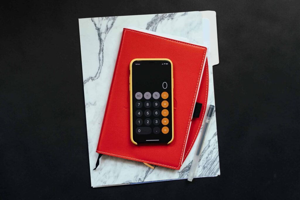 black Android smartphone on red flip case